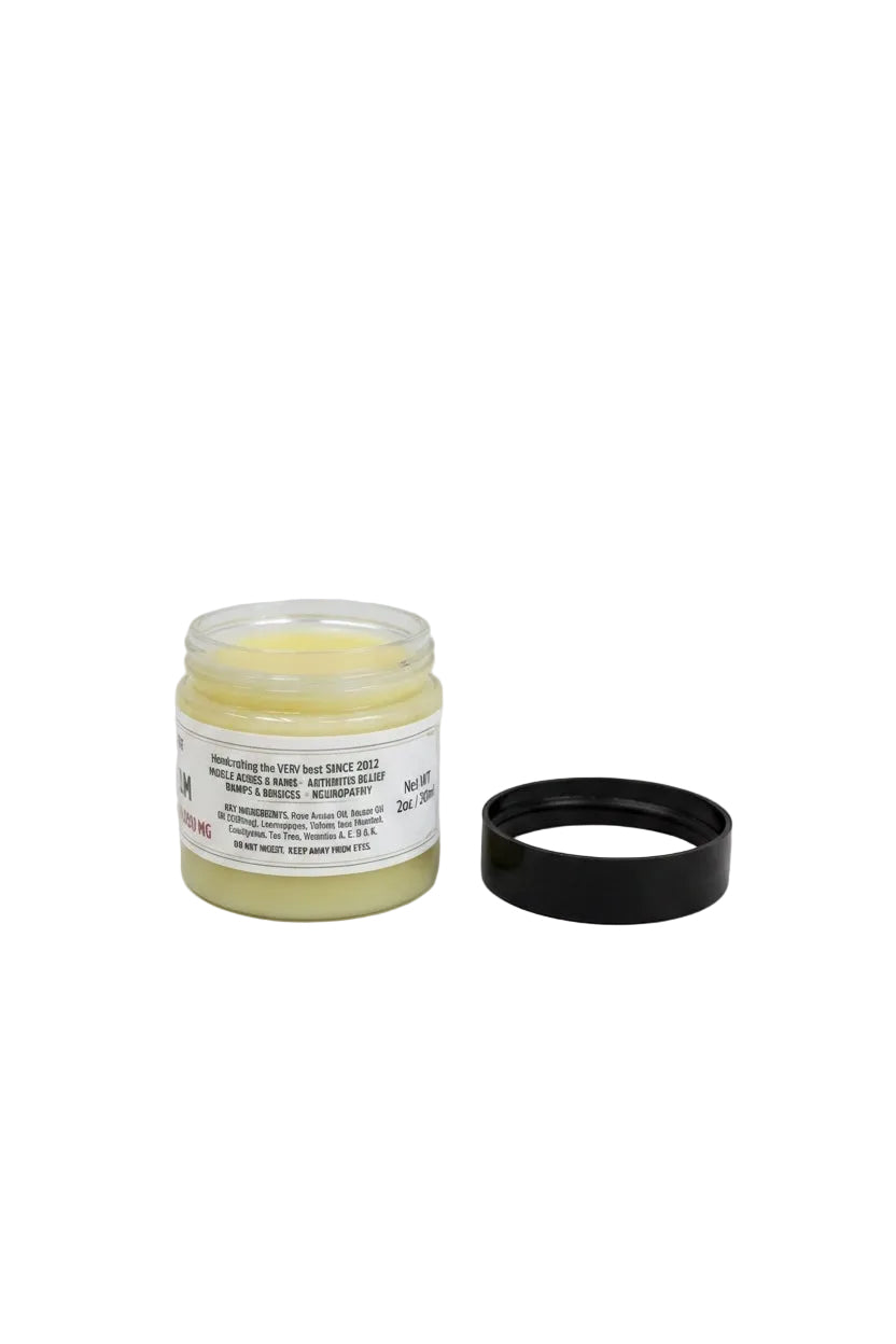 CONKLIN & CHEMIST Botanical Recovery Cream in a small glass jar with a black lid, featuring natural herbal ingredients.